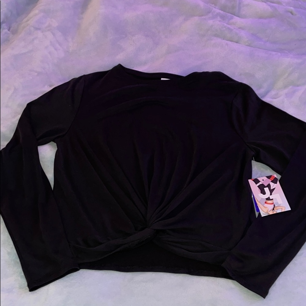 Black long sleeve athletic top with twist.